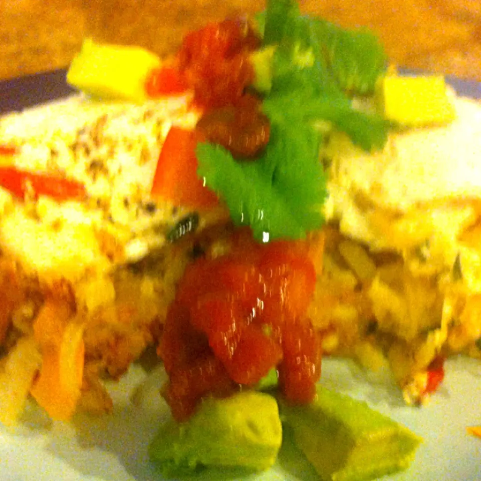 Loaded hash browns with over easy eggs, salsa , fresh tomatoes and avocado|virginia frasseさん