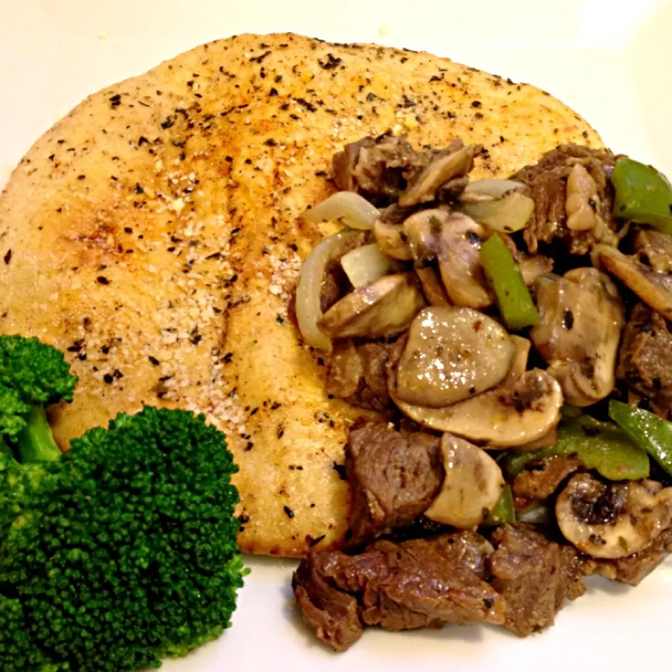 Cajun Steak bites w/ mushrooms, onions and green peppers over Pita lightly grilled in butter, basil, Italian seasoning, olive oil, cayenne pepper and garlic, to|Curt Chillさん