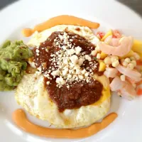 Last night's sides for fish tacos becomes this morning's huevos rancheros with shrimp ceviche, guacamole and chipotle cream.|Aaron Borchertさん