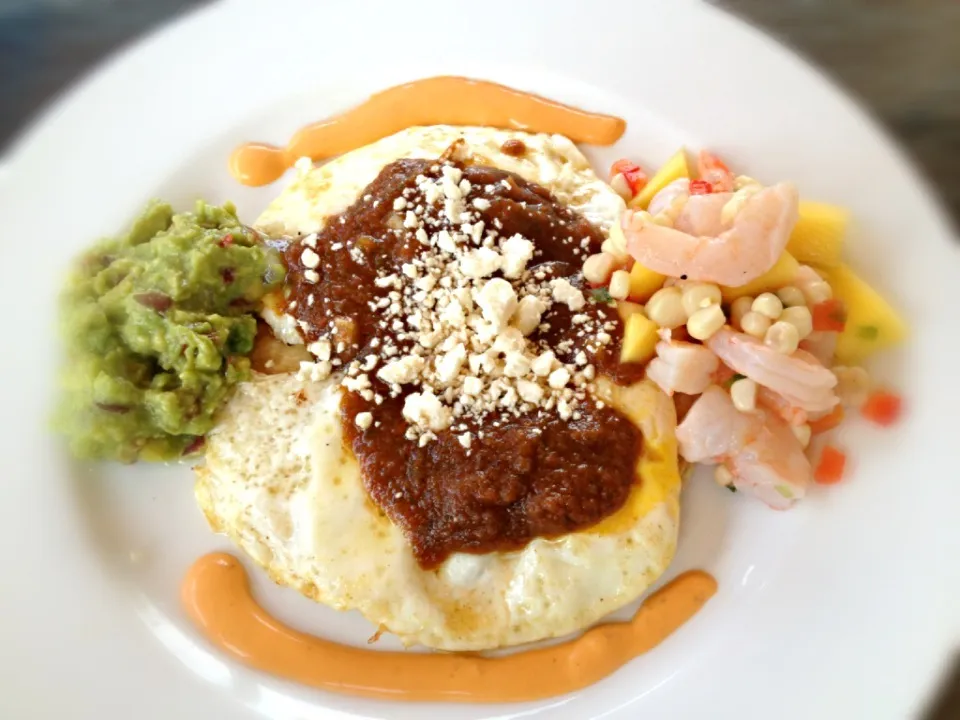 Last night's sides for fish tacos becomes this morning's huevos rancheros with shrimp ceviche, guacamole and chipotle cream.|Aaron Borchertさん