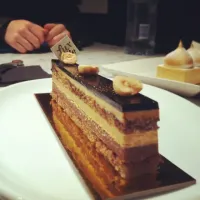 Snapdishの料理写真:hazelnut crumble base, banana ganache between a double salted caramel layer with a chocolate top.|melbourne, australiaさん