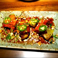 Whiskey Braised Pork Belly, grilled pineapple, soy reduction, cashews, jalapeño.|Dan Asikainenさん