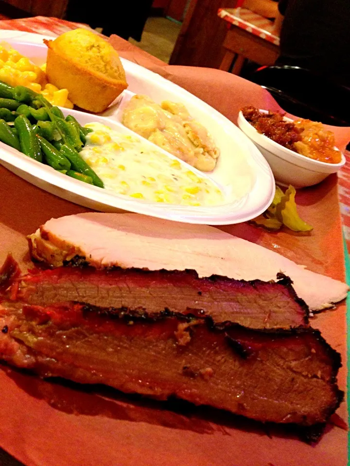 Snapdishの料理写真:Brisket, turkey, green beans, mac and cheese, creamed corn, cornbread, pudding, and cobbler.|Chris Rothさん