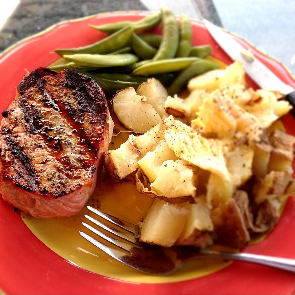 Grilled pork chops, sugar snap peas and potato.|Christopher Denman Williamsさん