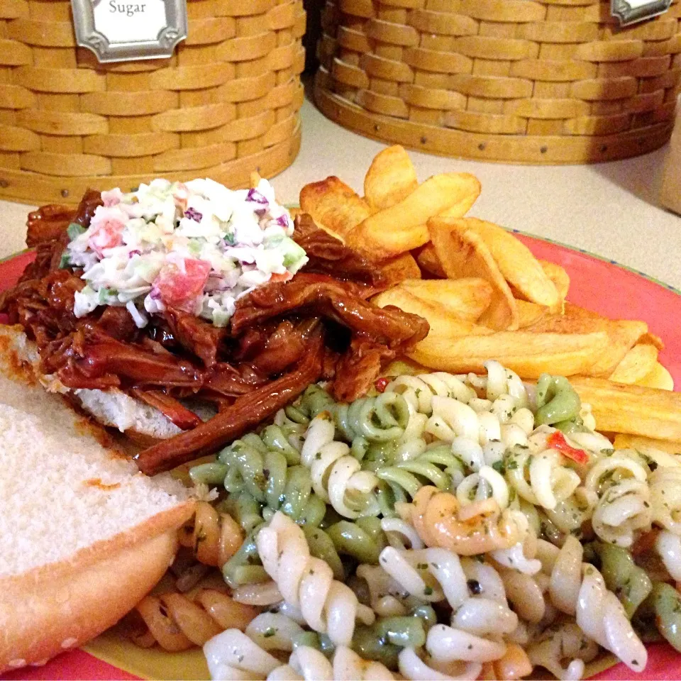 Snapdishの料理写真:BBQ pulled pork sandwiches topped with summer slaw, steak fries and pasta salad.|Christopher Denman Williamsさん