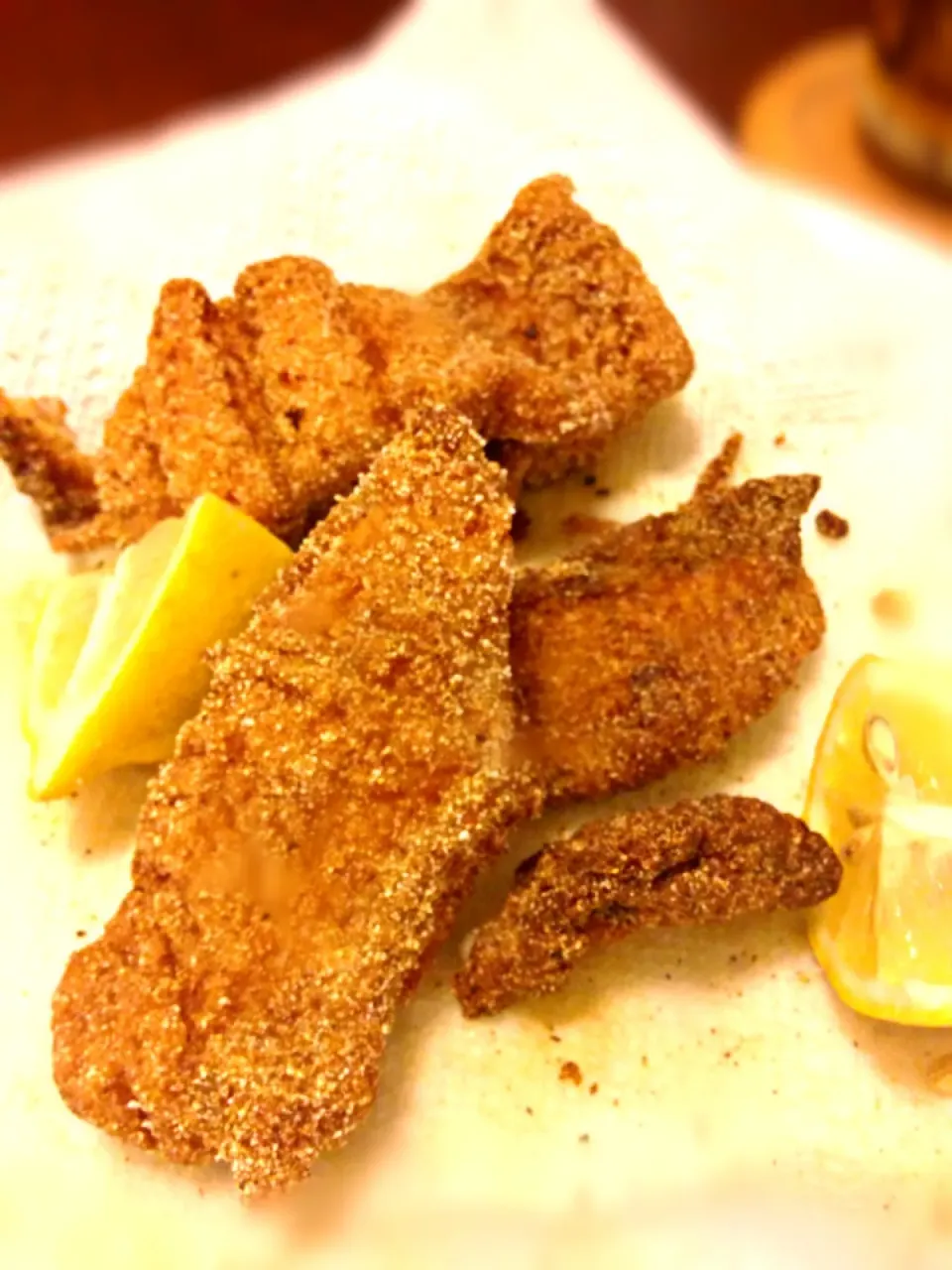 Shallow-fried cornmeal-battered catfish fillets.|Meg Davisさん