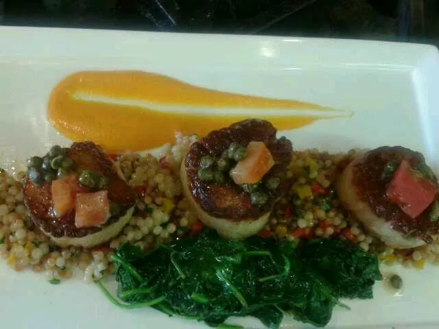 Snapdishの料理写真:diver scallops with  veg cous coous pepper coulie wilted spinach and caper better sauce|chef Meganさん