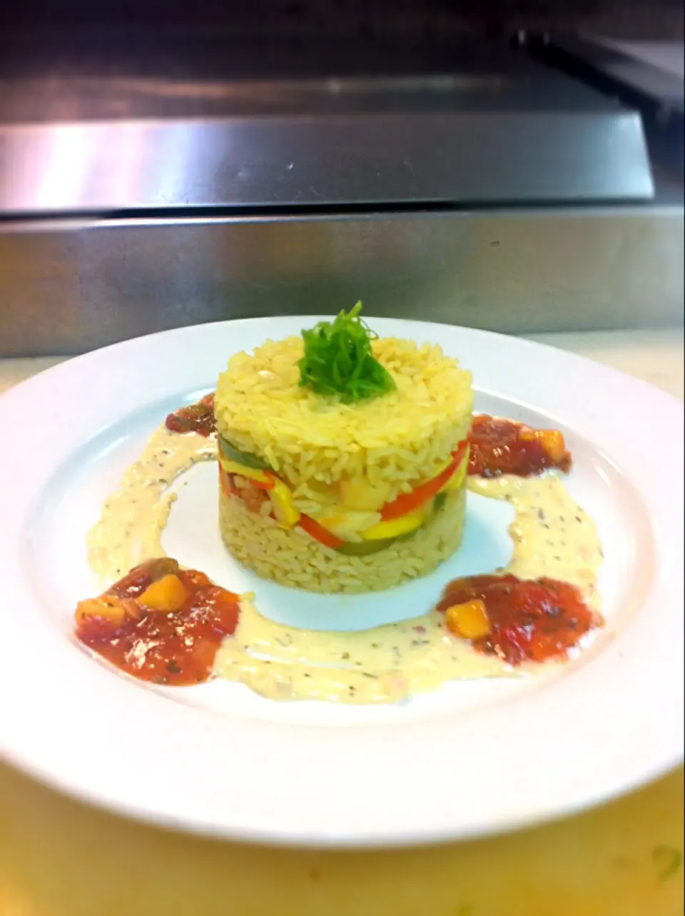 Yellow rice with sautéed veggies with a dill cream sauce and mango salsa|zac sayersさん