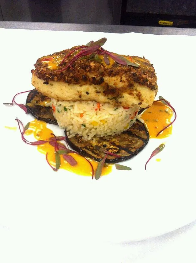 Pepita crusted Halibut, spring vegetable Pilaf, grilled Eggplant in a Citrus-Tomato Coulis|Bryan S. Mooreさん