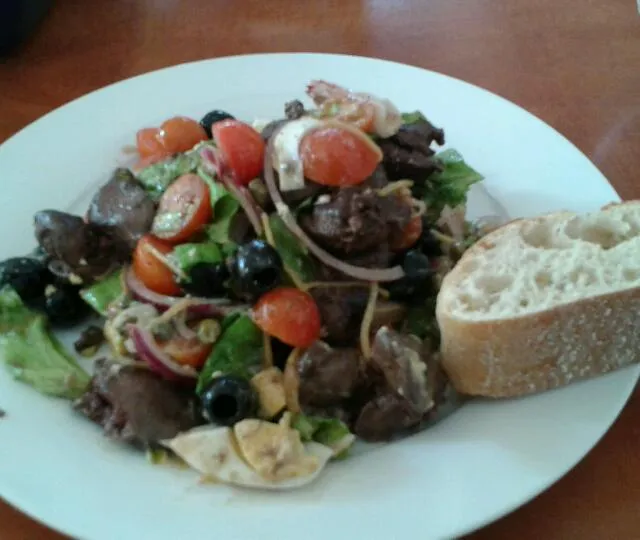 salad with olives, lettuce, tomato,  red onion, egg, chicken liver, capers, ansjovis vinaigrette|Jessさん