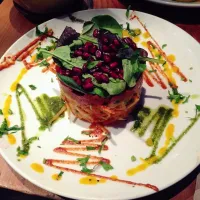 Thai Twist: Raw carrot, papaya and squash noodles with tomato nut crust, basil and pomegranate seeds