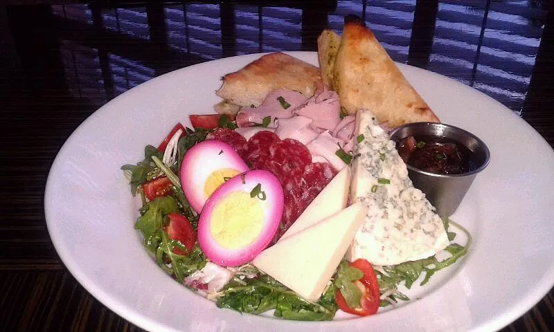 Snapdishの料理写真:Boca Ploughman Salad (Salumi, Roasted Turkey Breast, Parma Ham, Tomato, Stilton, Egg, Horseradish Cheddar, Fig Compote, mixed baby greens, Artisan Basil Bread) |Bryan S. Mooreさん