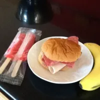 Snapdishの料理写真:Sandwich white bread salami turkey ham and butter banana and popsicle|Ashlyn Dogsさん