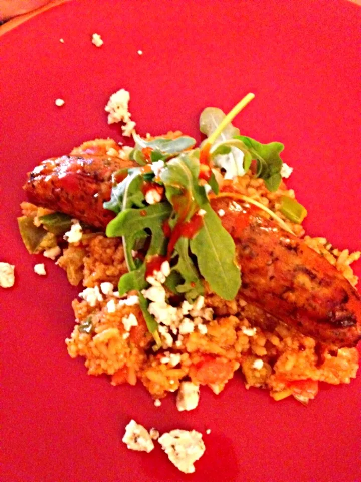 Grilled chicken artichoke gouda brats with mangos rice and arugula and feta topping with pineapple.|amyさん