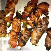 Snapdishの料理写真:bacon wrapped jalapenos, with cream cheese and goat cheese stuffed in side. naturally I grilled them, since al things taste better kissed by an open flame.|Joshua Stephen Treadwayさん