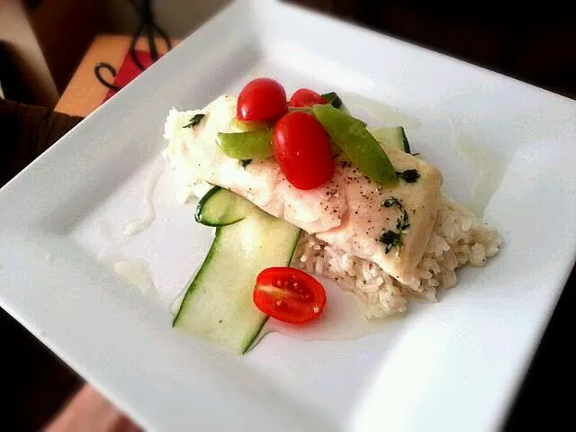 poached red snapper with seasoned cucumbers tomatoes and sugar snap peas on bed of rice|jeffさん