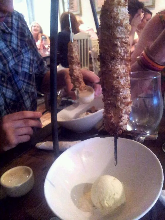 Snapdishの料理写真:Banana covered in dessicated coconut and toasted served with vanilla ice cream and toffee sauce.|hollyさん