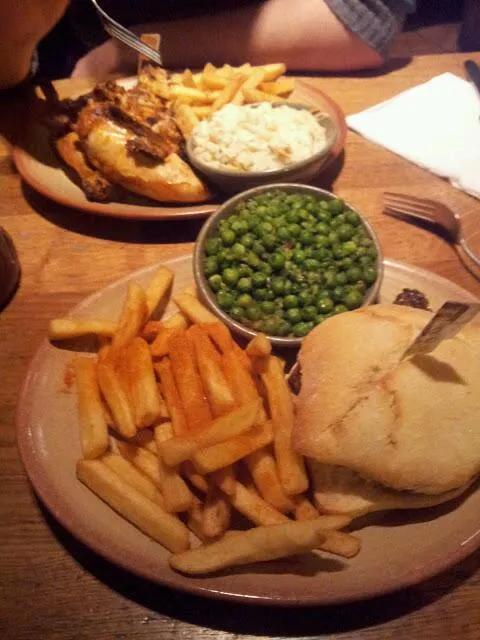 Nando's! half chicken, piri piri salt chips, macho peas, coleslaw and a steak burger with hullumi cheese.|hollyさん