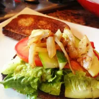 Snapdishの料理写真:Avocado sandwich with tomatoes, cucumbers, spinach, lettuce, and caramelized onions. Pepper and a squeeze of lemon to top it off|krista parkerさん