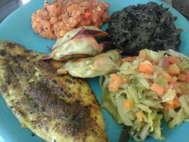 Snapdishの料理写真:African dinner: north african spiced catfish, moroccan red lentil, south african spiced greens, curried cabbage, and vegetable samosas|Culinary Kissesさん