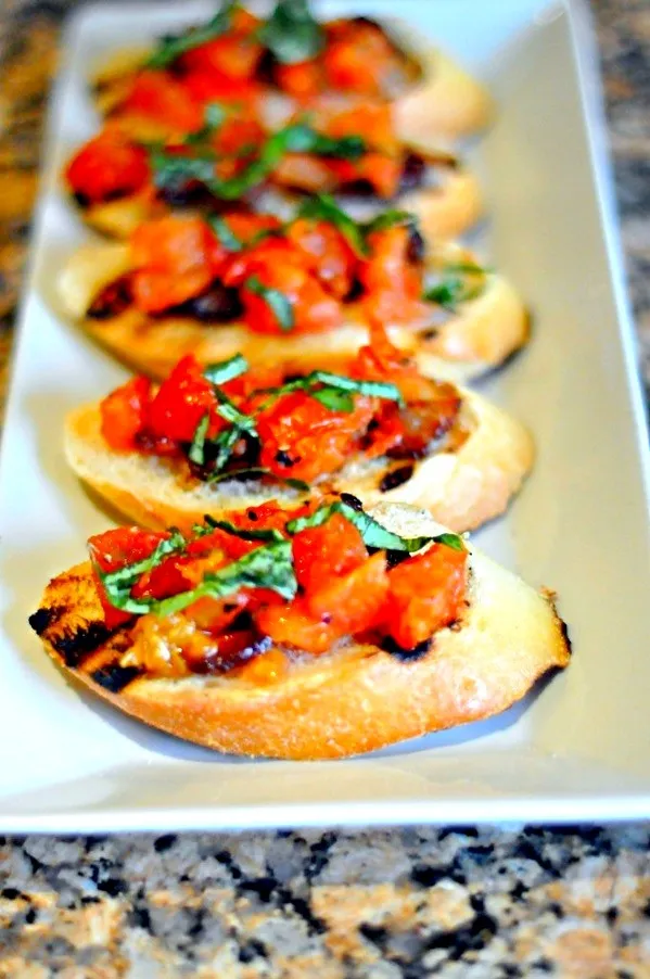 Snapdishの料理写真:Basil,roasted tomato and bacon Bruschetta|kelly ighiriaroさん