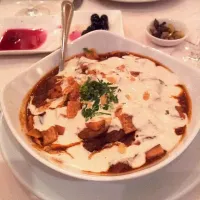 Snapdishの料理写真:Lamb in a rich tomato sauce with fried bread, aubergines garlic herbs and white sauce.|hollyさん