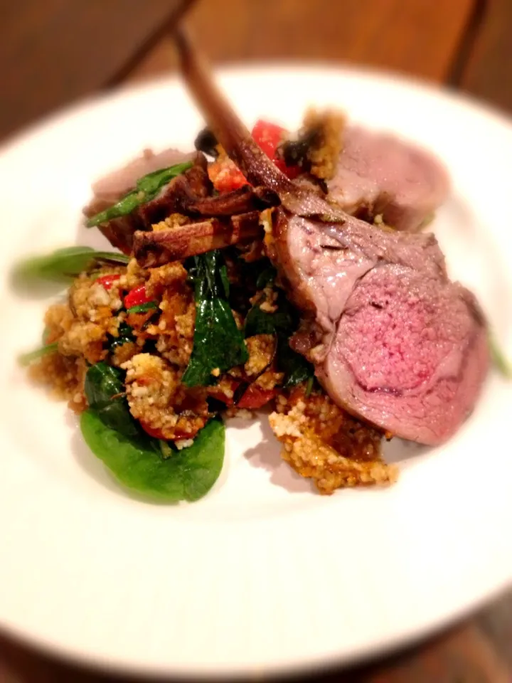 Roast rack of lamb with pumpkin tomato and spinach cous cous topped with raspberry and rosemary glaze|woodfiredさん