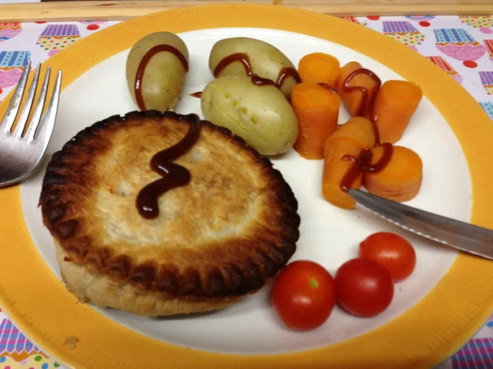 Snapdishの料理写真:Linda McCartney Country pie with steamed new potatoes and carrots, garnished with cherry tomatoes and brown sauce|Alan (Fred) Pipesさん