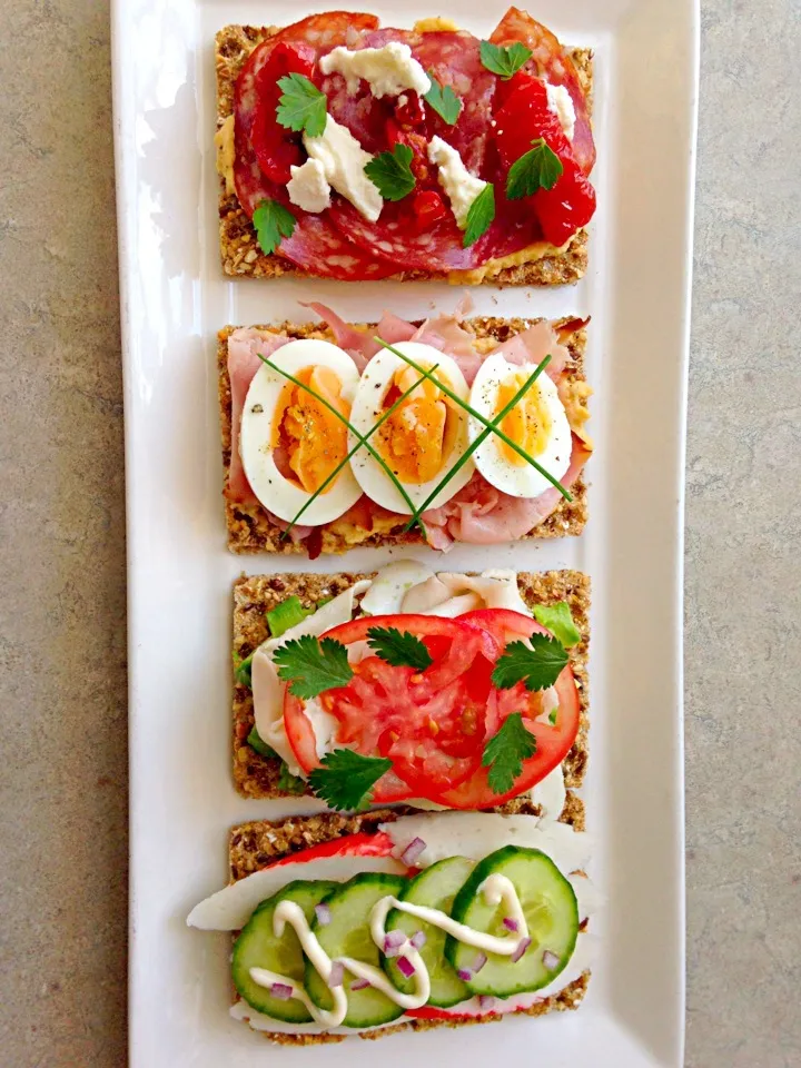 Multigrain crackers 4 ways, seafood cucumber japanese mayo, chicken avocado tomato, ham egg and hummus, salami semi dried tomato ricotta|Chrisy Hillさん