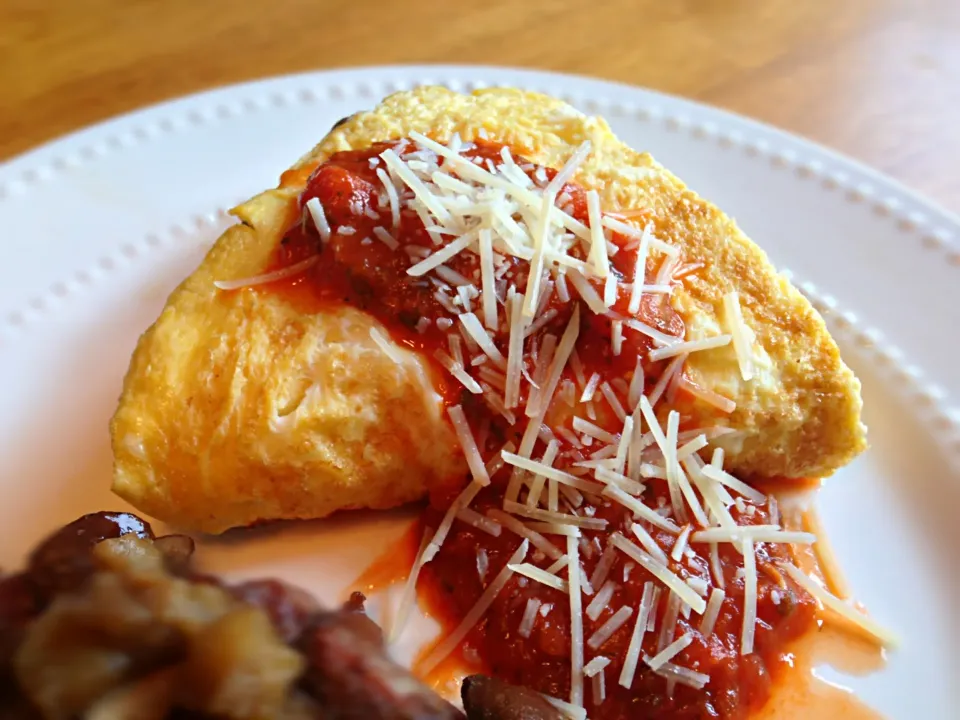 Egg white one yolk sautéed portabella mushroom and eggplant with feta and mozzarella cheese omelette topped with spicy tomato pesto with fresh Parmesan cheese a|Gary Langerさん