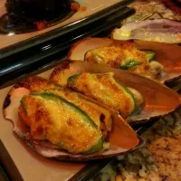 Snapdishの料理写真:baked mussels and a quail egg nestled in tobiko in the back ground I think its called izura|alisonさん