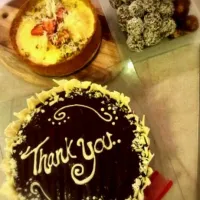 sugar free cheesecake w pistachio crust and strawberries.. chocolate truffles & baileys chocolate cake.|cjさん