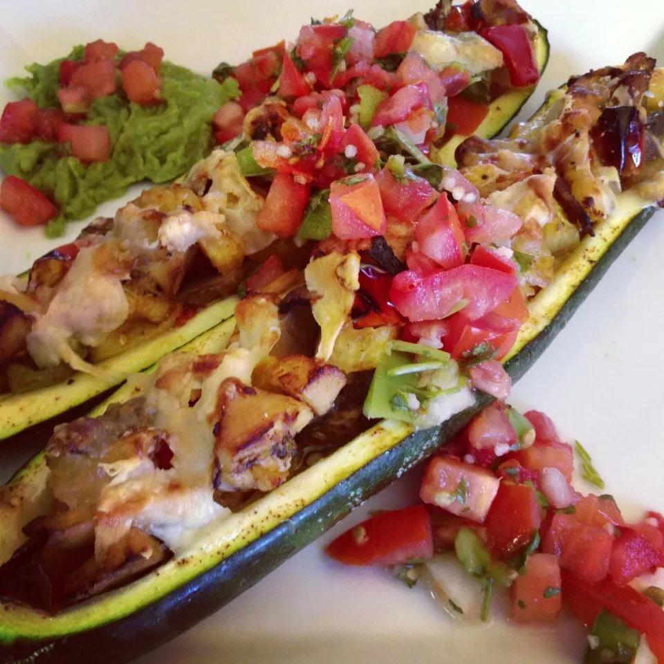 Snapdishの料理写真:Baked Zucchini Boats: Stuffed w/ Grilled Chicken, Sautéed Mushrooms, Onions, Tri-Color peppers, Cherry Tomatoes, Pineapples, Broccoli & Carrots, Topped w/ Parme|Curt Chillさん