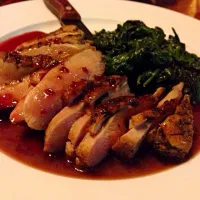 Crispy duck with a port wine reduction sauce and sautéed garlic spinach.|kimber geeさん