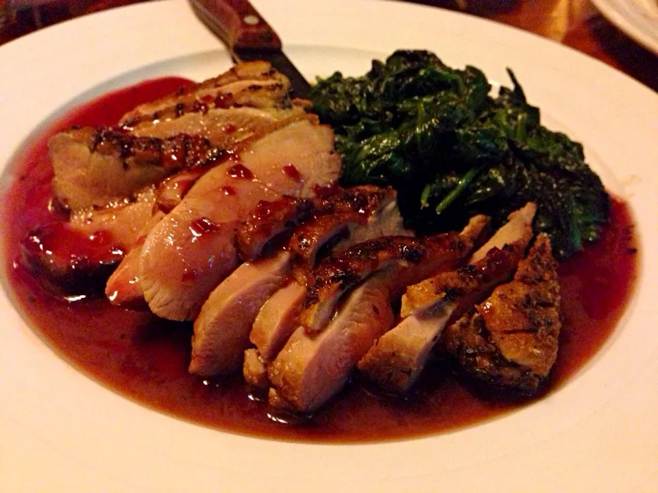 Crispy duck with a port wine reduction sauce and sautéed garlic spinach.|kimber geeさん