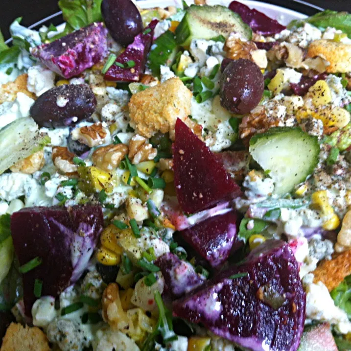 Gorgonzola, beets, cucumber, greek olives , walnuts, and corn relish on a bed of greens|virginia frasseさん