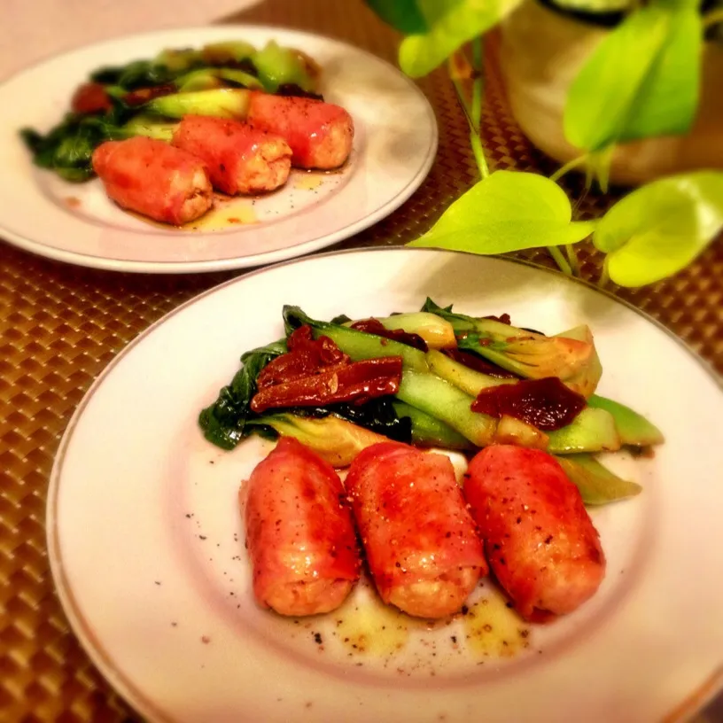 Snapdishの料理写真:Barrel shaped chicken hamburgers wrapped in prosciutto and sautéed Chinese spinach and porcini mushrooms.|Kirk Awiamさん