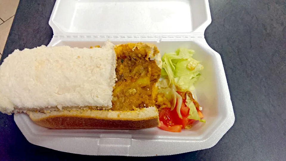 Snapdishの料理写真:South African bunny chow ..mutton curry and quarter of loaf of bread|shakeelさん