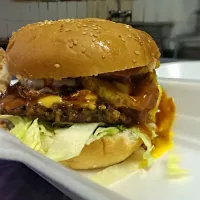 Snapdishの料理写真:awesome burger 150 gram beef pattie.salad.egg.and tangy chilly sauce dripping on golden brown crispy onion fried rings...|shakeelさん