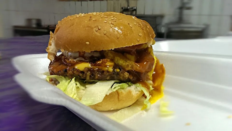 Snapdishの料理写真:awesome burger 150 gram beef pattie.salad.egg.and tangy chilly sauce dripping on golden brown crispy onion fried rings...|shakeelさん