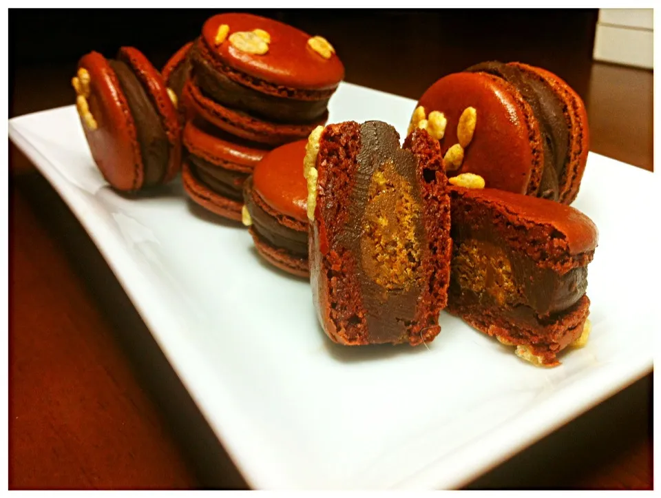 Snapdishの料理写真:Milk and Dark chocolate macarons with caramelized rice krispies|Nick Ekasinghさん