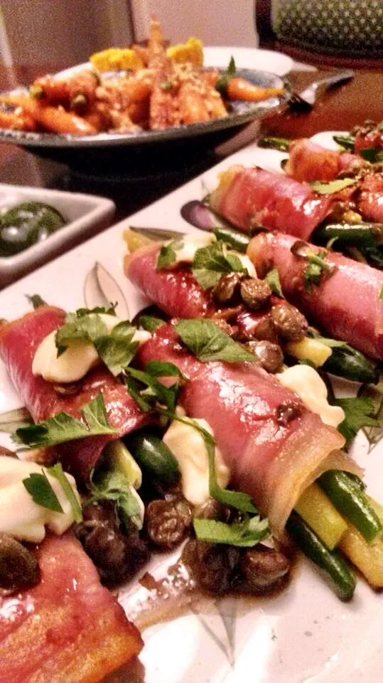 Snapdishの料理写真:Beans wrapped in prosciutto with lemon and caper dressing|Navapat Inmelbourneさん