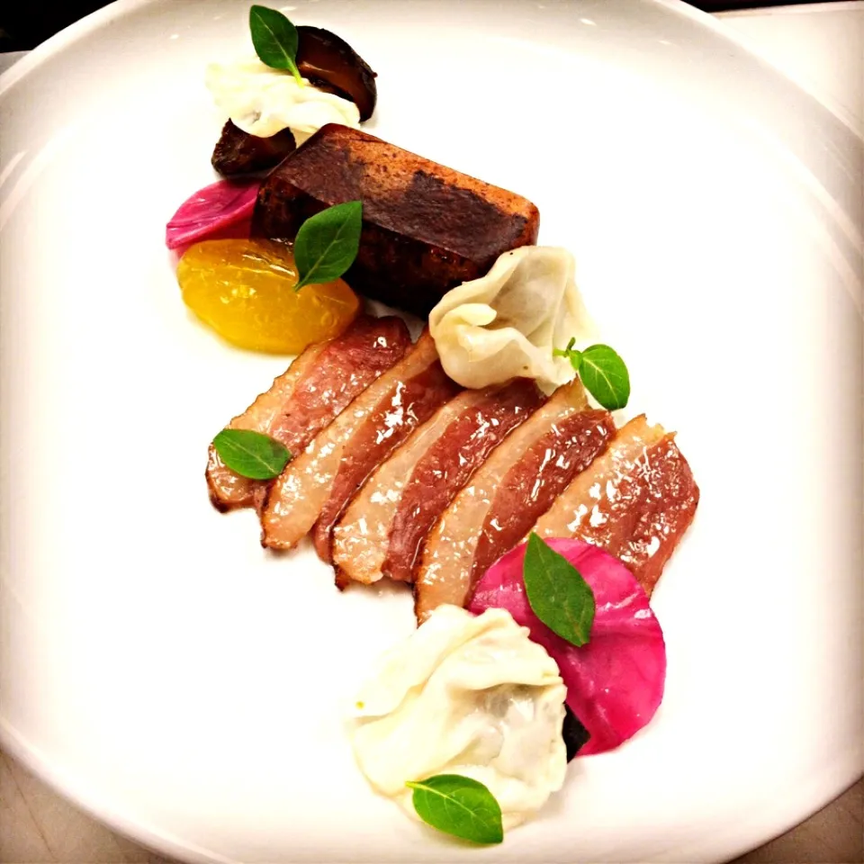 Cured duck breast, pickled shiitake, orange sauce ( garnishes of pickled cabbage, blueberry leather & honey dipped charred bread)|andrew franciscoさん