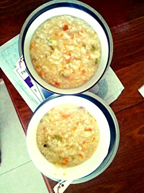 Snapdishの料理写真:Carrot celery goji egg porridge|Xi wenさん