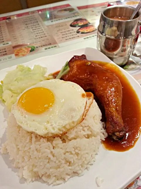 Snapdishの料理写真:Egg with chicken thigh on rice n hot milk tea 8 USD|Arthurさん