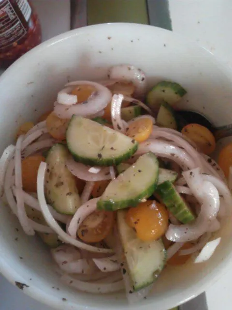 Cucumber, tomato, and onion salad. With evoo, red wine vinegar, salt and pepper to taste.|Polly Gelfusoさん