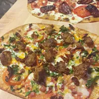 Pizza with mozzarella, Sun dried tomatoes, fresh tomatoes prosciutto, meatballs.|Jorelさん