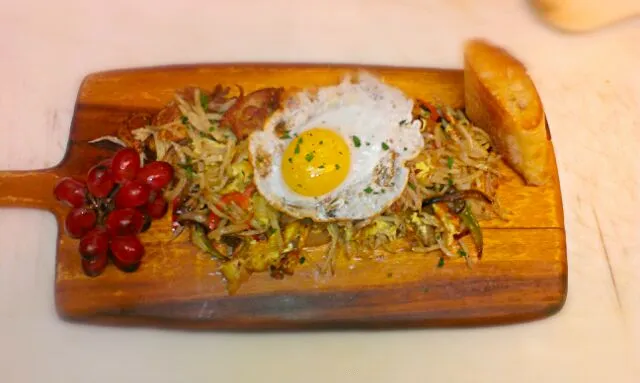 Snapdishの料理写真:Crispy potato stings with caramelized onion, sauteed peppers, duck confit and fried egg|Patrick fennさん