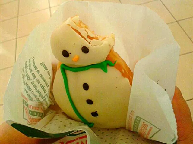 Snow man doughnut at Krispy Kreme. "oh, oh,....don't eat me! I'm so cute!"|Frannyさん