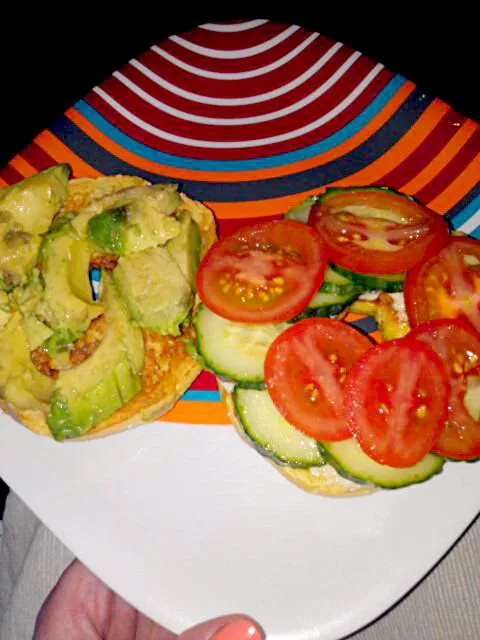 Corn bagel with vegan mayo, Himalayan pink sea salt, avocado, tomato, and cucumber.|Polly Gelfusoさん